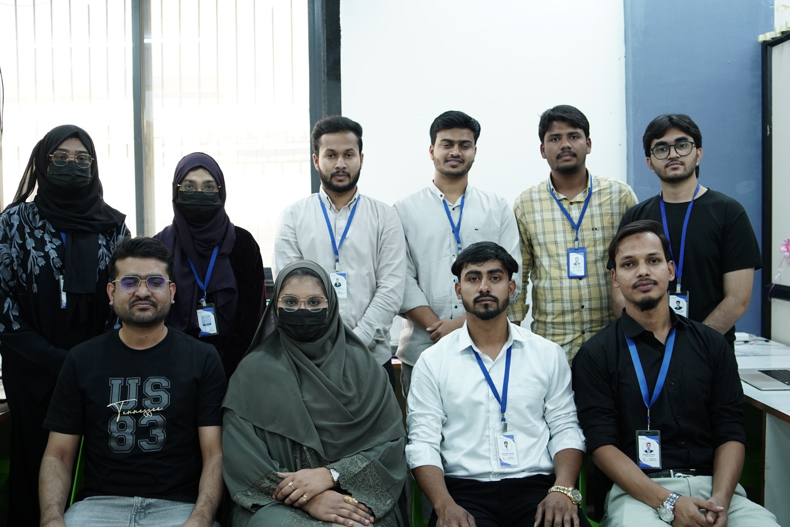Faimsoft Academy learners and mentors posing together in the training room